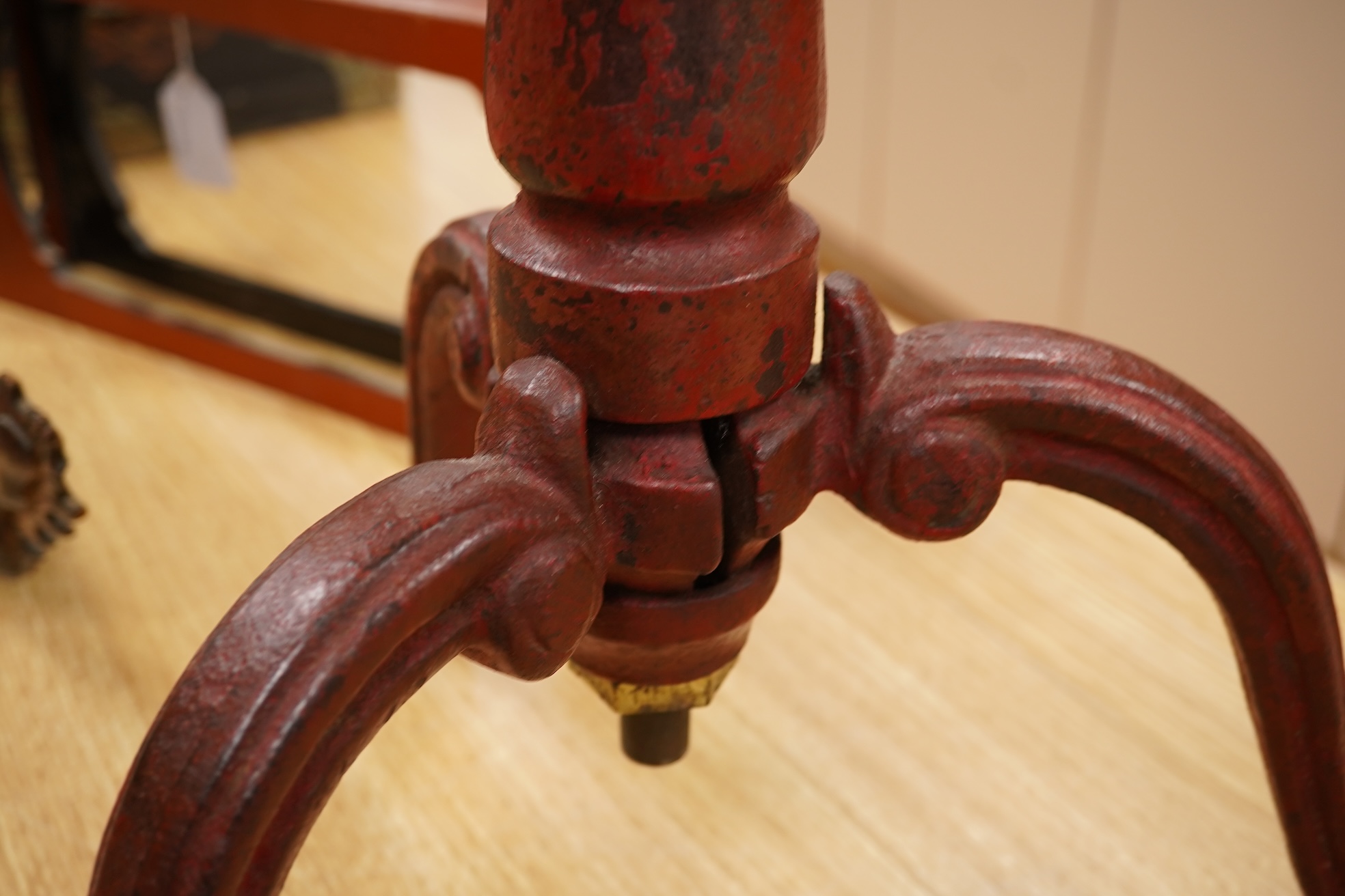A 19th century red japanned (heavy) cast iron telescopic tripod base, 63cm minimum